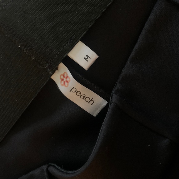 Peach nylon spandex black flare pants. NWOT - Picture 2 of 5